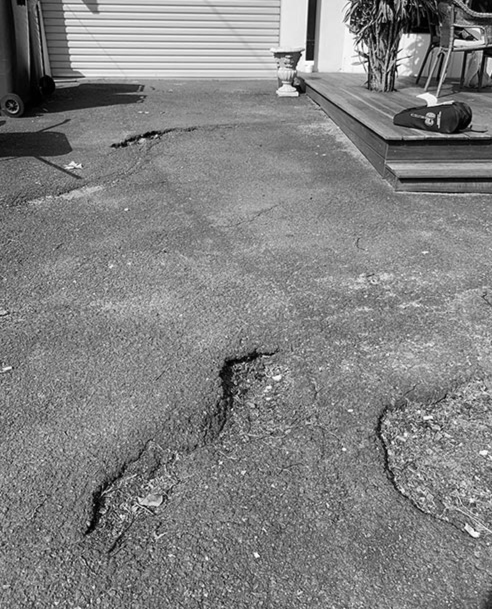 Driveway before asphalt resurfacing by Colossal Asphalt