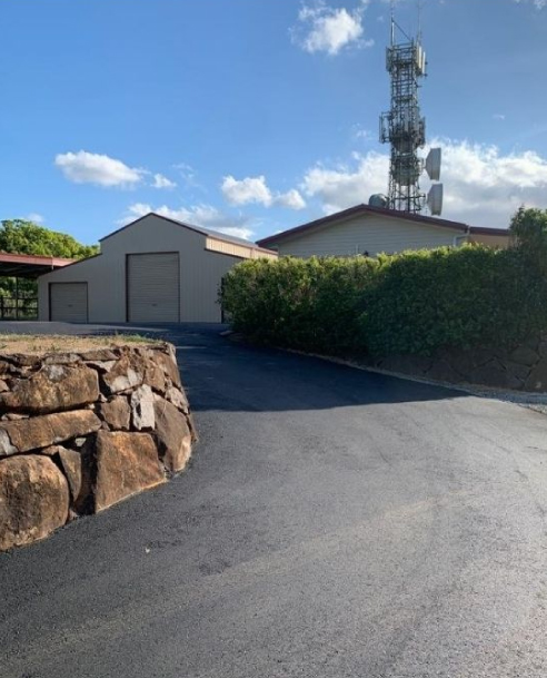 Driveway after asphalt resurfacing by Colossal Asphalt